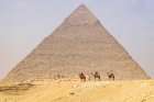 Giza-Cairo-Egypt Men on camels at the Great Pyramid complex Art Print